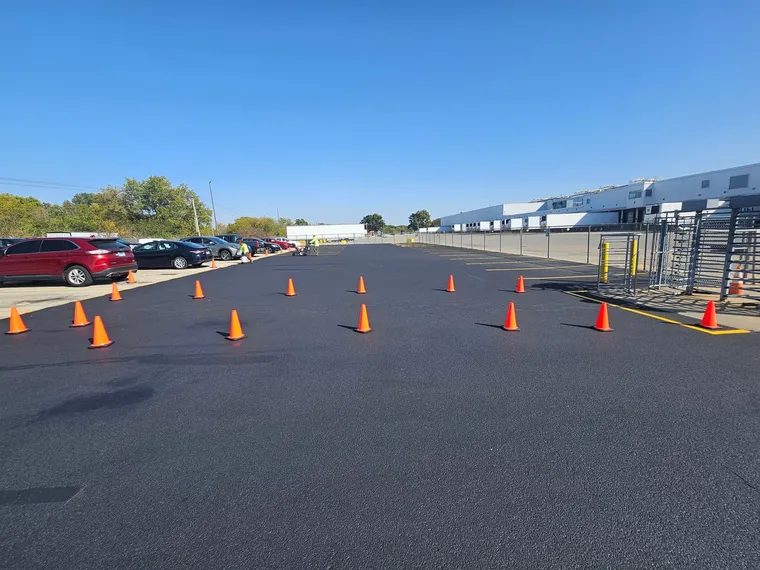 Seal coating applied to an asphalt parking lot